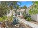 Landscaped front yard with various plants, gravel and concrete path at 1658 Autumn Rust Dr, Las Vegas, NV 89119