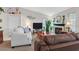 Cozy living room showcasing comfortable seating, a TV, and decorative accents on the walls at 1658 Autumn Rust Dr, Las Vegas, NV 89119