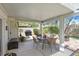 This cozy covered patio offers ample seating and BBQ, ideal for outdoor entertaining at 1658 Autumn Rust Dr, Las Vegas, NV 89119