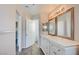 Bathroom featuring double sinks with modern cabinets, framed mirrors, and a doorway to the toilet room at 1979 Cutlass Dr # 1979, Henderson, NV 89014