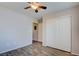 Bedroom featuring wood-look floors, a ceiling fan, and closet with sliding doors at 1979 Cutlass Dr # 1979, Henderson, NV 89014
