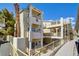 Beige building exterior with multiple stories, balconies, and an exterior stairwell at 1979 Cutlass Dr # 1979, Henderson, NV 89014