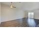 Spacious living room with modern ceiling fan and sliding glass doors to the outside at 1979 Cutlass Dr # 1979, Henderson, NV 89014
