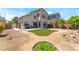 Spacious backyard with a patch of green lawn, offering a relaxing outdoor space with easy to maintain desert landscaping at 4708 Grand Rock Dr, North Las Vegas, NV 89081