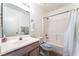 Bathroom featuring a single vanity, a mirror, and a shower-tub combo at 4708 Grand Rock Dr, North Las Vegas, NV 89081