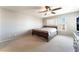 Bedroom with neutral carpet, a window, and a ceiling fan at 4708 Grand Rock Dr, North Las Vegas, NV 89081