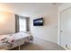 Bedroom with a large television and access to the ensuite bathroom at 4708 Grand Rock Dr, North Las Vegas, NV 89081