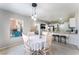 Dining room features table with seating for six and a backyard view at 4708 Grand Rock Dr, North Las Vegas, NV 89081