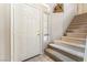 Inviting entryway with carpeted stairs, tile floor, and a charming niche at 4708 Grand Rock Dr, North Las Vegas, NV 89081