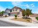 Beautiful desert landscaped home featuring a two-car garage, and desert landscaping at 4708 Grand Rock Dr, North Las Vegas, NV 89081