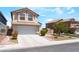 Lovely home featuring a two-car garage, a tile roof, and desert landscaping at 4708 Grand Rock Dr, North Las Vegas, NV 89081