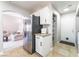 Modern kitchen featuring stainless steel appliances, white cabinets, and ample storage space at 4708 Grand Rock Dr, North Las Vegas, NV 89081