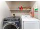 Laundry room featuring a front loading washer and top loading dryer at 4708 Grand Rock Dr, North Las Vegas, NV 89081