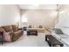Open living room featuring neutral walls, plush carpeting, and comfortable seating at 4708 Grand Rock Dr, North Las Vegas, NV 89081