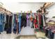 Walk-in closet with organized hanging clothes and shelf space for storage at 4708 Grand Rock Dr, North Las Vegas, NV 89081