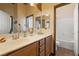 Bathroom with dual sinks, custom cabinets, and large mirrors at 5300 E La Terra Ave, Pahrump, NV 89061