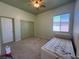 Comfortable carpeted bedroom with large closet, a queen size bed, and natural light from window at 5300 E La Terra Ave, Pahrump, NV 89061