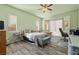 Comfortable main bedroom offers natural light, wood floors, and spacious layout at 5300 E La Terra Ave, Pahrump, NV 89061
