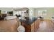 Spacious kitchen island open to Gathering room with stainless appliances and tile flooring at 5300 E La Terra Ave, Pahrump, NV 89061