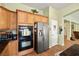Kitchen area featuring stainless steel appliances and custom wood cabinets at 5300 E La Terra Ave, Pahrump, NV 89061