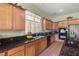 Contemporary kitchen with sleek granite countertops, stainless steel appliances, and modern cabinetry at 5300 E La Terra Ave, Pahrump, NV 89061