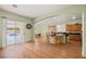 Open concept kitchen and living area with tile floors, granite countertops, and breakfast bar seating at 5300 E La Terra Ave, Pahrump, NV 89061