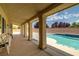 Outdoor pool area features a covered patio with tiled flooring and ample seating at 5300 E La Terra Ave, Pahrump, NV 89061