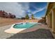 Backyard swimming pool with privacy walls and desert landscaping at 5300 E La Terra Ave, Pahrump, NV 89061