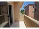 This home features a private balcony with exterior views and natural light streaming in through the sliding glass doors at 6652 Weeping Pine St, Las Vegas, NV 89149