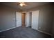 Spacious bedroom with ceiling fan, closet, gray carpet, and neutral paint at 6652 Weeping Pine St, Las Vegas, NV 89149