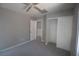 Bedroom featuring carpeted floor, ceiling fan and closet space at 6652 Weeping Pine St, Las Vegas, NV 89149