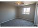 Bedroom with neutral gray carpet, window providing natural light, and simple finishes at 6652 Weeping Pine St, Las Vegas, NV 89149