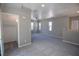 Spacious carpeted bedroom with a ceiling fan, natural light, and a walk-in closet for ample storage at 6652 Weeping Pine St, Las Vegas, NV 89149
