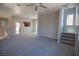 Expansive living room leading to the kitchen with neutral walls and carpet at 6652 Weeping Pine St, Las Vegas, NV 89149