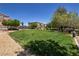Beautiful community park with lush green grass, mature trees, walking paths, and a charming gazebo at 6652 Weeping Pine St, Las Vegas, NV 89149