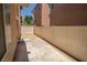 Outdoor patio space with concrete and gravel areas, enclosed by a white fence at 6652 Weeping Pine St, Las Vegas, NV 89149