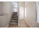 View of the carpeted staircase leading to the upper level of the house at 6652 Weeping Pine St, Las Vegas, NV 89149