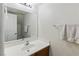 Bathroom featuring single sink vanity, a large mirror, and a towel rack at 1069 Thrill Ct # 102, Henderson, NV 89002
