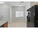 Bright eat-in kitchen with neutral tile flooring and storage at 1069 Thrill Ct # 102, Henderson, NV 89002