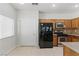 Eat-in kitchen equipped with modern appliances and neutral tile flooring at 1069 Thrill Ct # 102, Henderson, NV 89002