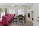 Open-concept living room with hardwood floors, fireplace, and comfortable seating area at 1069 Thrill Ct # 102, Henderson, NV 89002