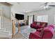 Cozy living room featuring a staircase and a large screen TV at 1069 Thrill Ct # 102, Henderson, NV 89002