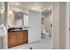 Elegant bathroom with white tiled floor and partial view of the toilet in the room at 135 E Harmon Ave # 2515, Las Vegas, NV 89109