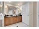 Bright bathroom featuring dual sinks, elegant fixtures, and a sleek black countertop at 135 E Harmon Ave # 2515, Las Vegas, NV 89109