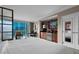 Comfortable bedroom with city views, kitchenette, seating area, and an abundance of natural light at 135 E Harmon Ave # 2515, Las Vegas, NV 89109