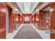 Hallway with a table and decorative mirror, with elevator doors in the background at 135 E Harmon Ave # 2515, Las Vegas, NV 89109