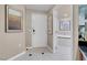 Elegant hallway leading to the entrance and bathroom featuring tile floor at 135 E Harmon Ave # 2515, Las Vegas, NV 89109