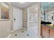 Elegant hallway leading to the entrance and bathroom featuring tile floor at 135 E Harmon Ave # 2515, Las Vegas, NV 89109