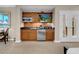Modern kitchenette featuring sleek cabinets, stainless steel appliances, and a charming breakfast nook at 135 E Harmon Ave # 2515, Las Vegas, NV 89109