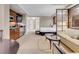 Open living area with a kitchenette, sofa, and room divider at 135 E Harmon Ave # 2515, Las Vegas, NV 89109